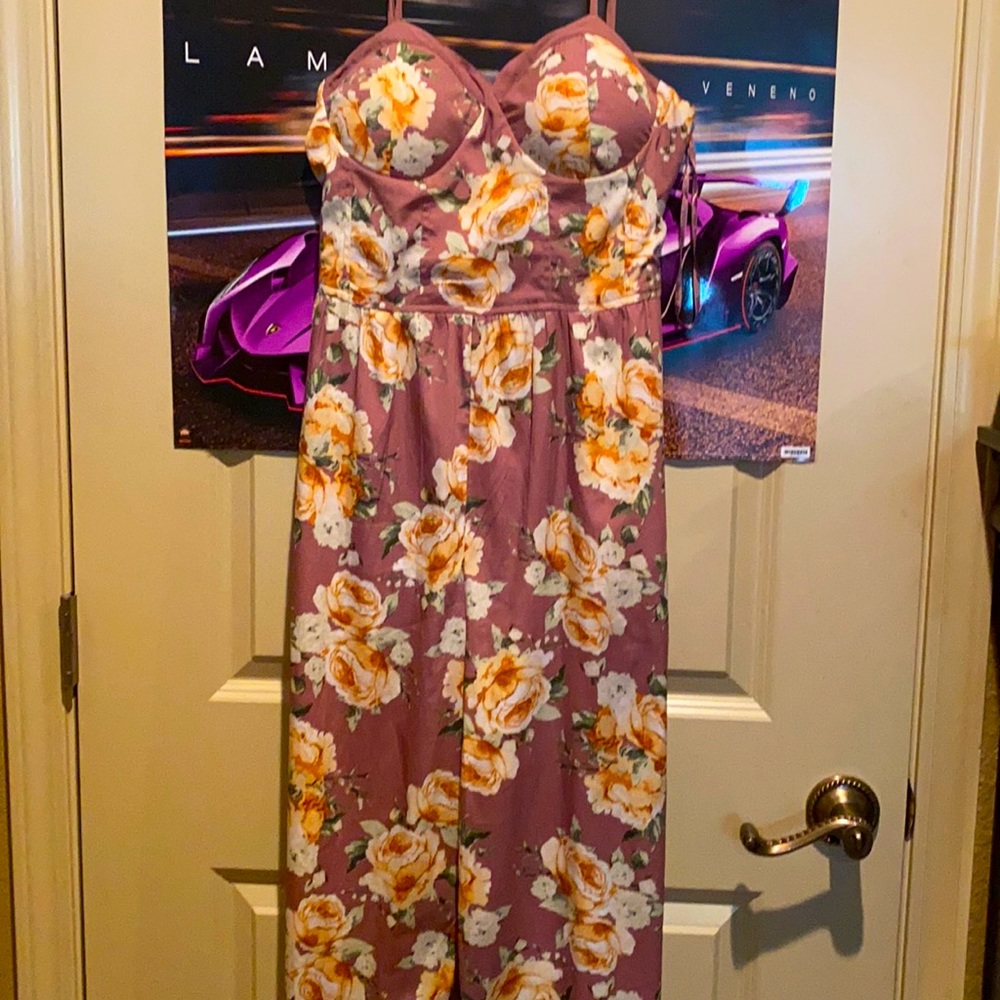 Pink jumpsuit with flowers all over. Brand band of gypsies size large